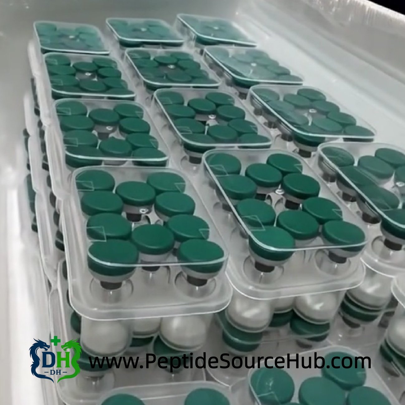 ACE-031 peptide trays with green caps — export-ready preparation