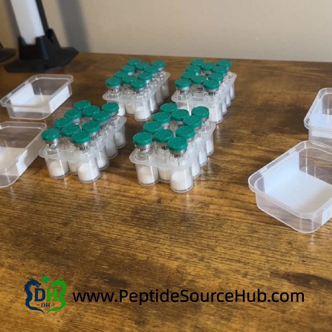 ACE-031 peptide trays on workbench — kit staging for packing