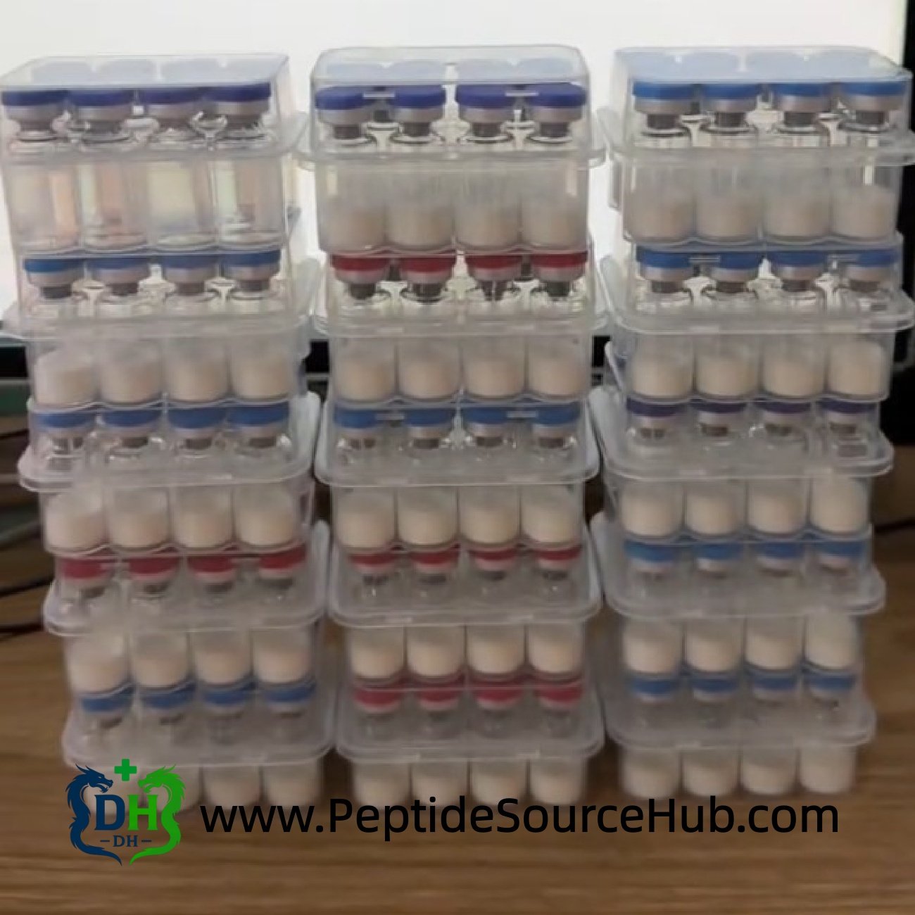 Stacked trays of peptide vials for bulk fulfillment, mixed cap colors