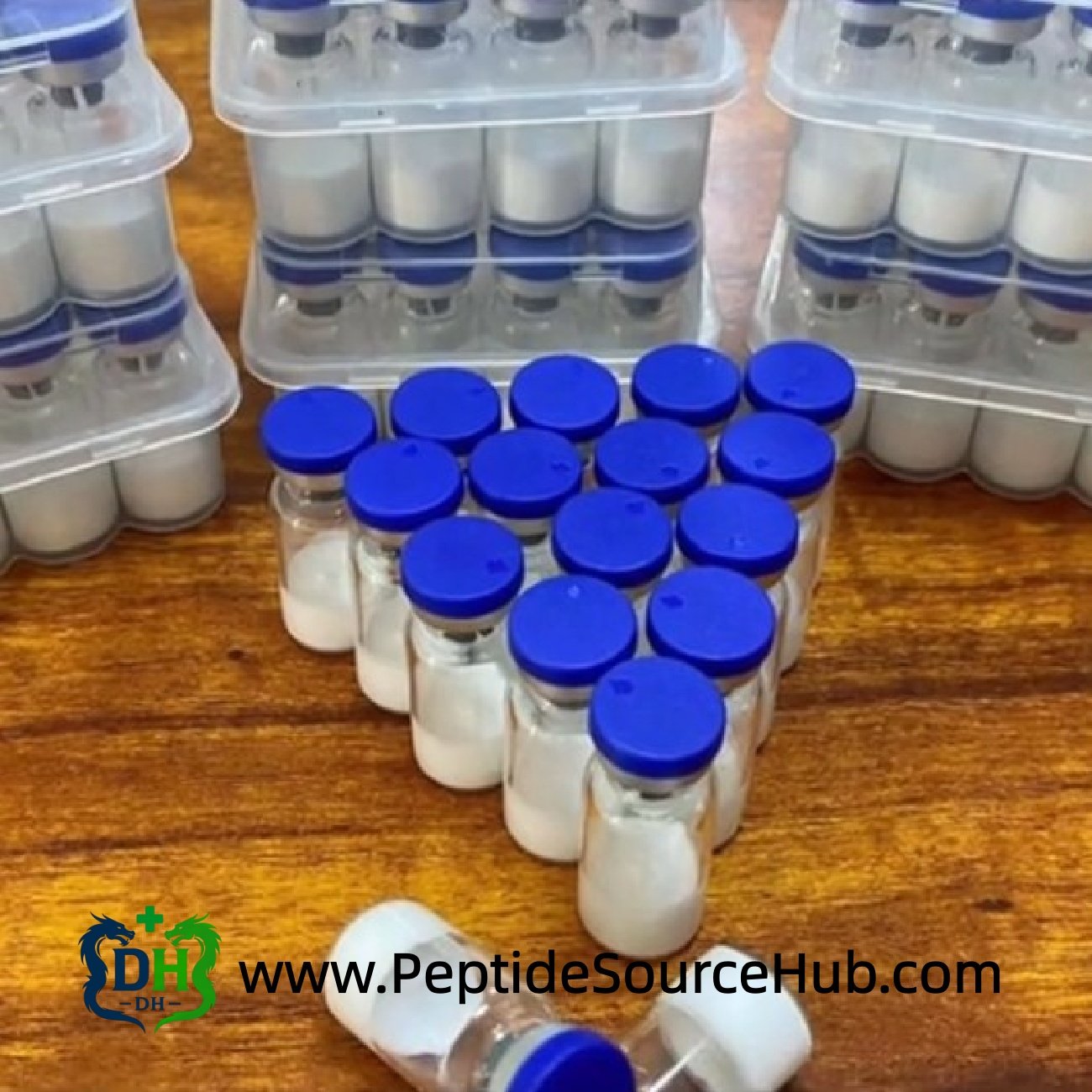 Blue-cap vial group photo for BPC-157 5 mg + TB-500 5 mg Blend, multiple vials and trays on table