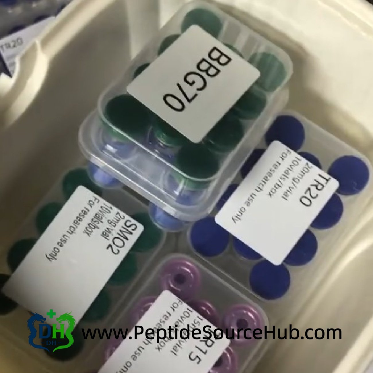 BBG70 and green cap peptide trays inside plastic container