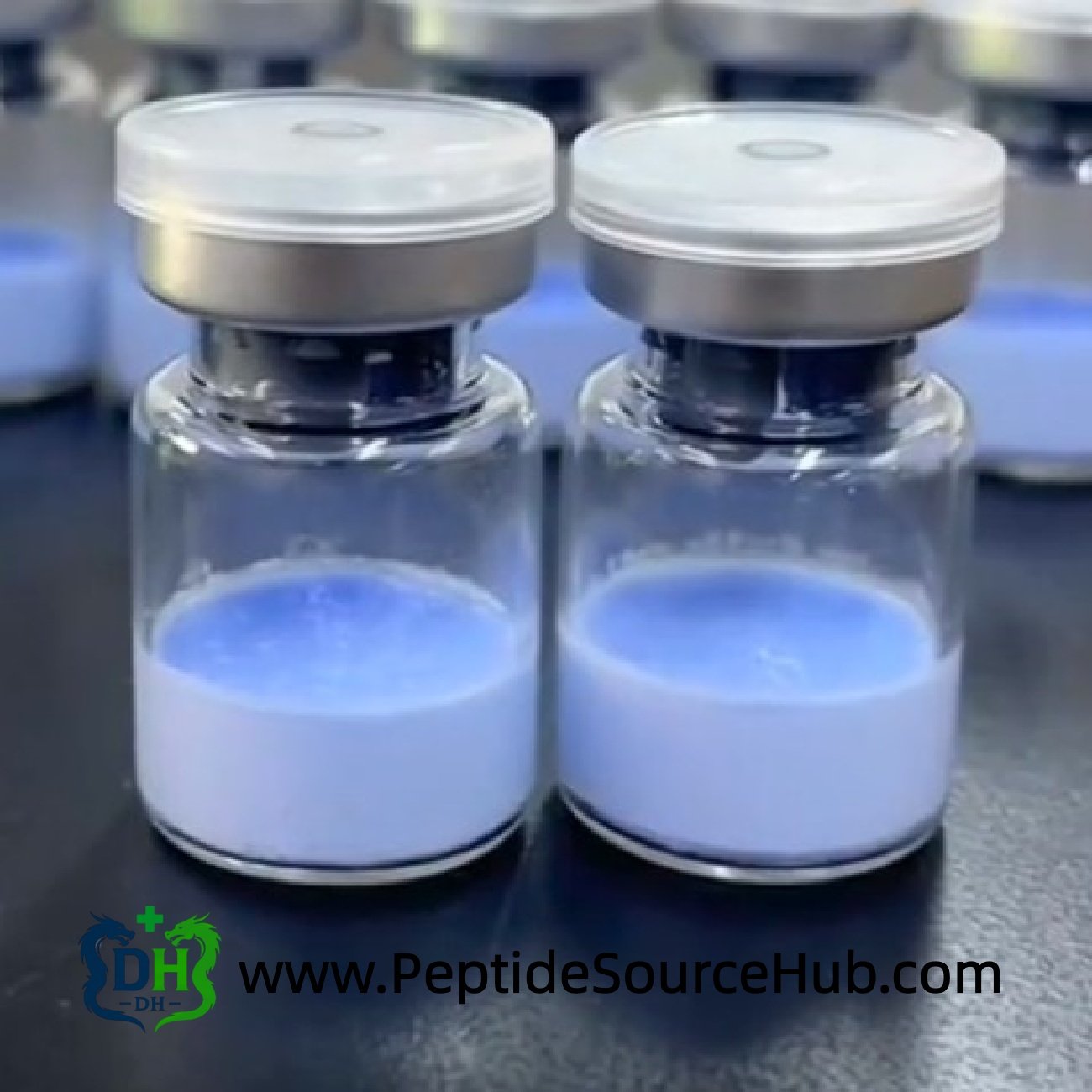 Close-up of two blue copper Glow peptide vials