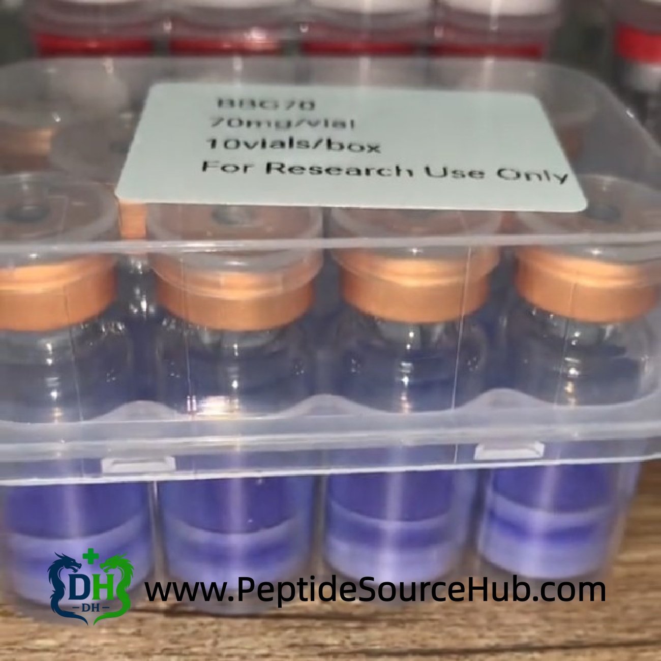 Close-up of BBG70 Glow 70 mg gold cap peptide tray
