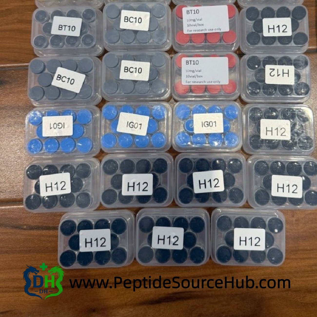 Custom HGH 6–36 IU dark-cap vials labeled H12 in bulk trays