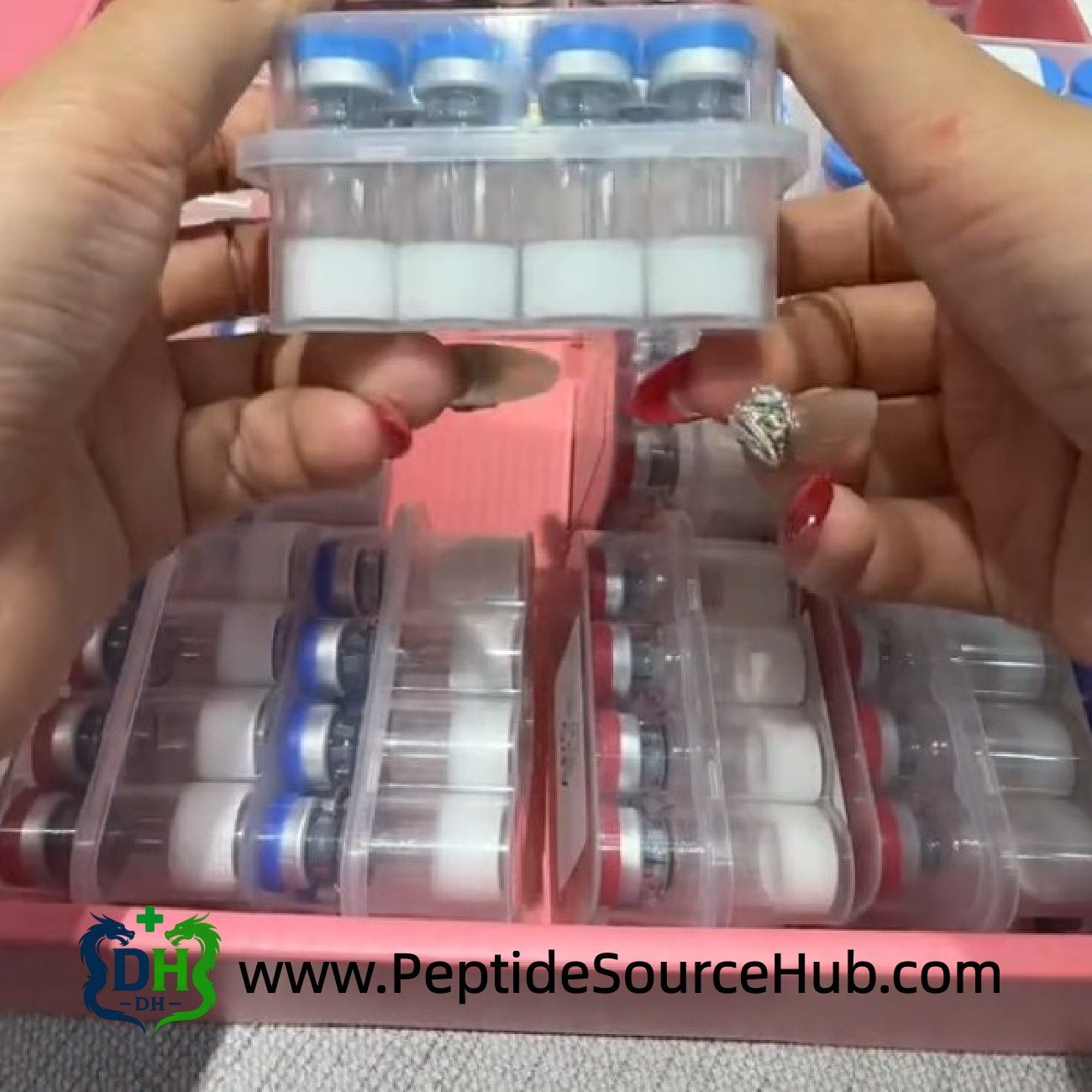 Custom HGH tray with blue caps lifted above sample box