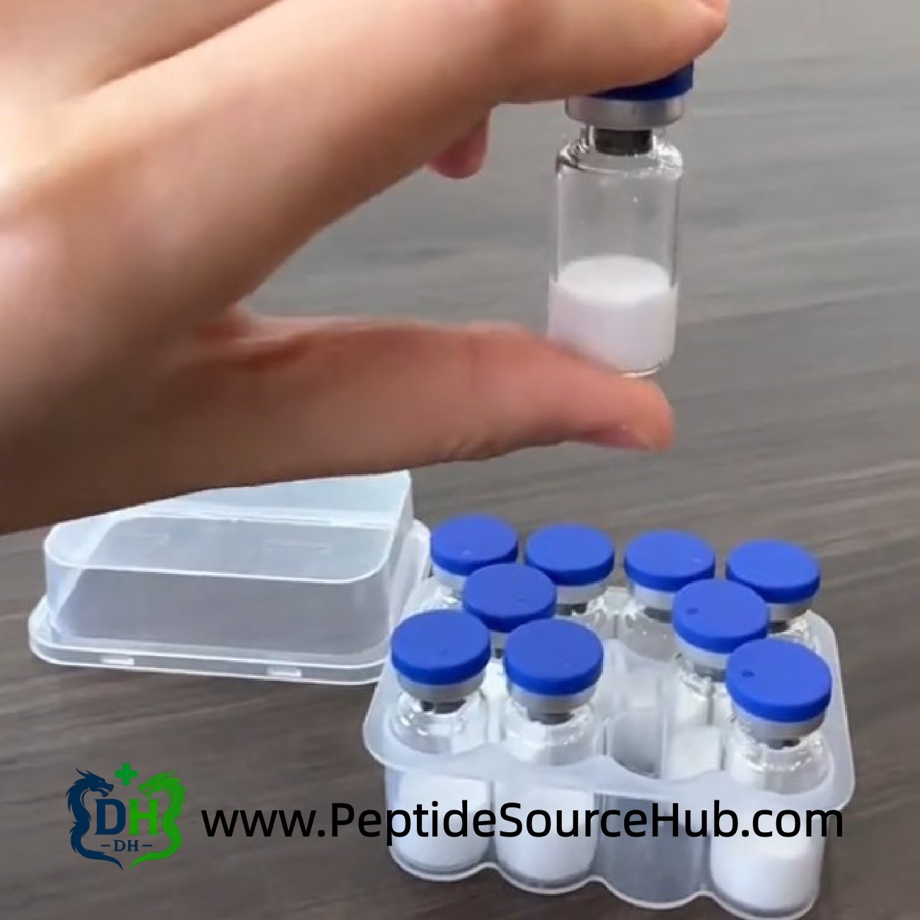 Hand holding Follistatin-344 peptide vial above blue-cap tray
