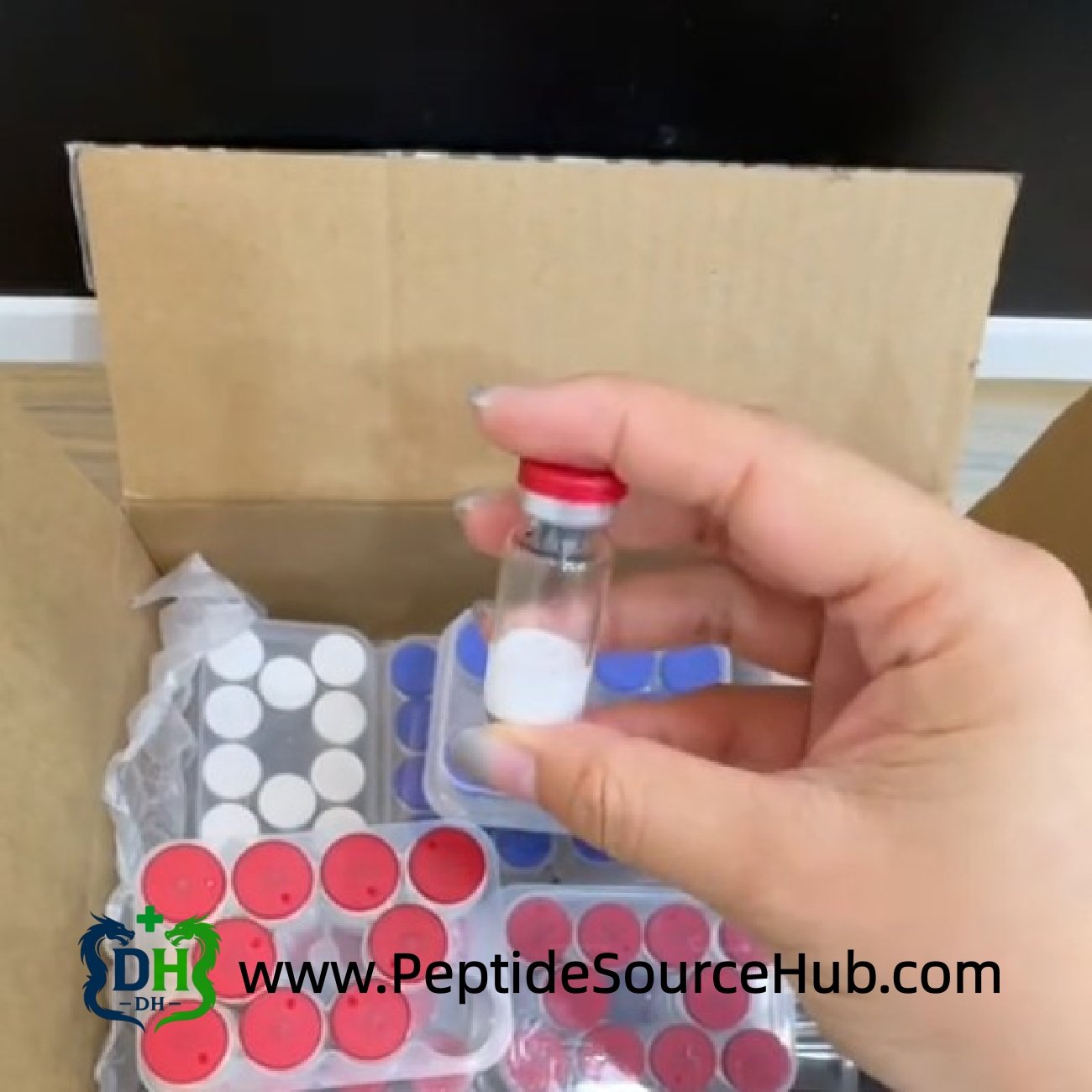 Follistatin-344 peptide vial with red cap near shipping carton