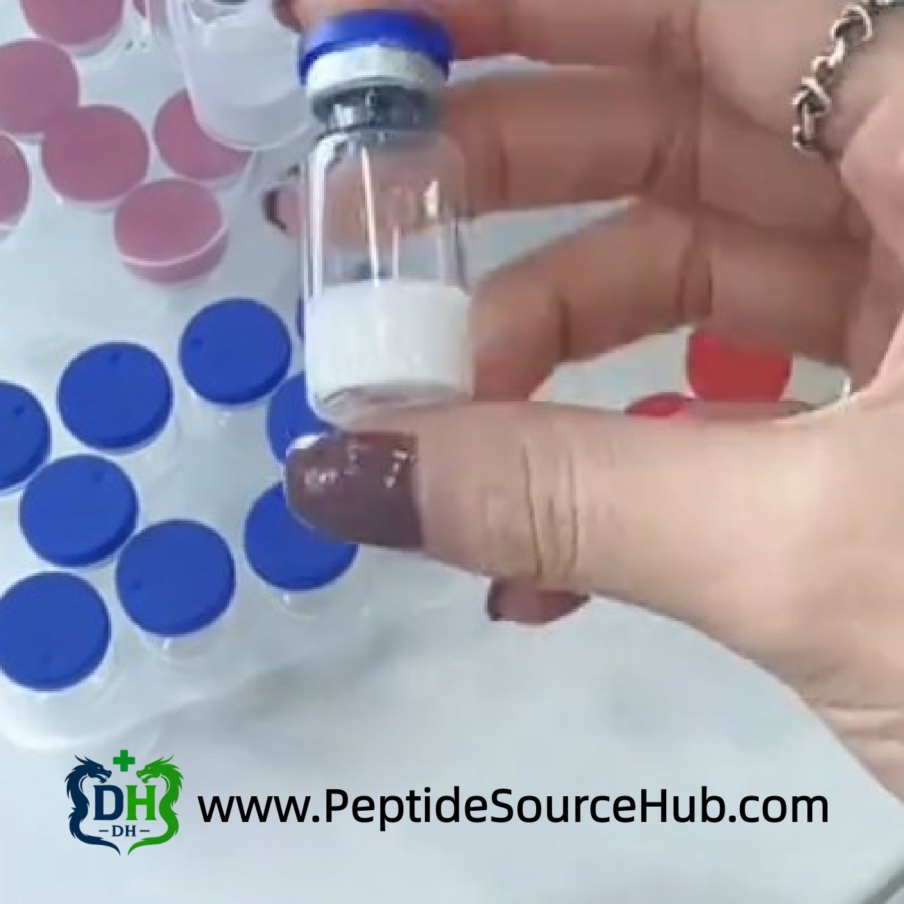 Single FOXO4 peptide vial held above trays