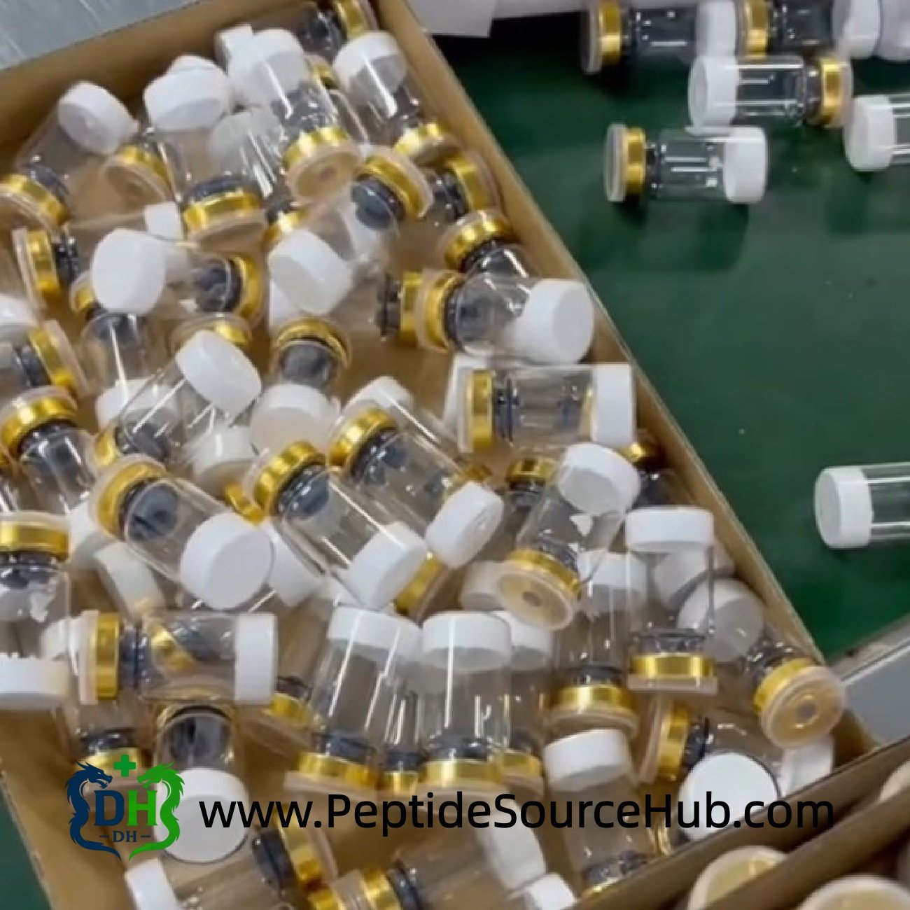 Empty gold cap vials prepared for HGH Fragment 176-191 filling
