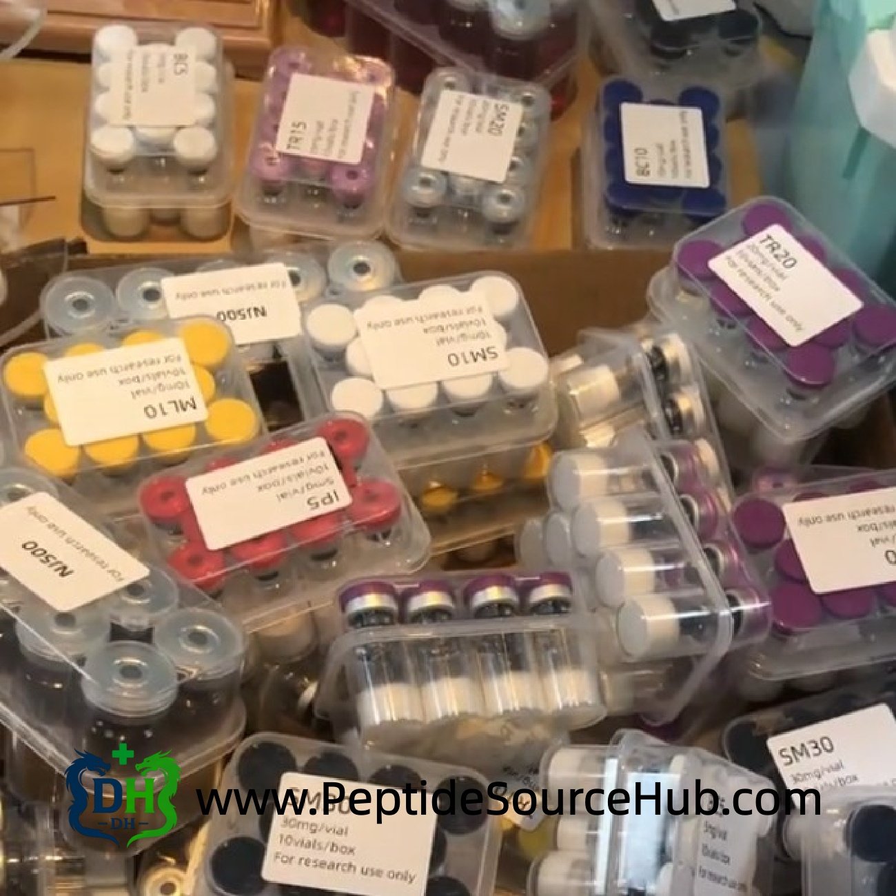 Assorted peptide vials in clamshell trays ready for export
