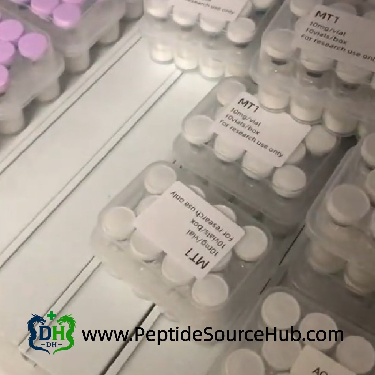 Melanotan I MT1 10mg white-cap vials in labeled 10-vial boxes moving along inspection line