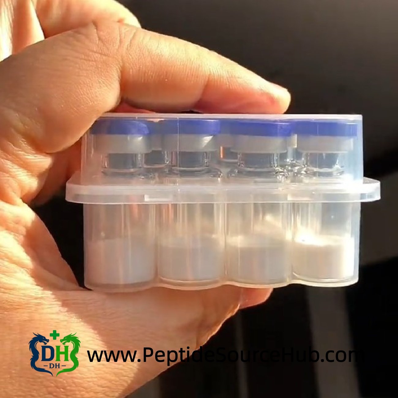 Side view of blue cap Melatonin 10 mg vial tray in hand