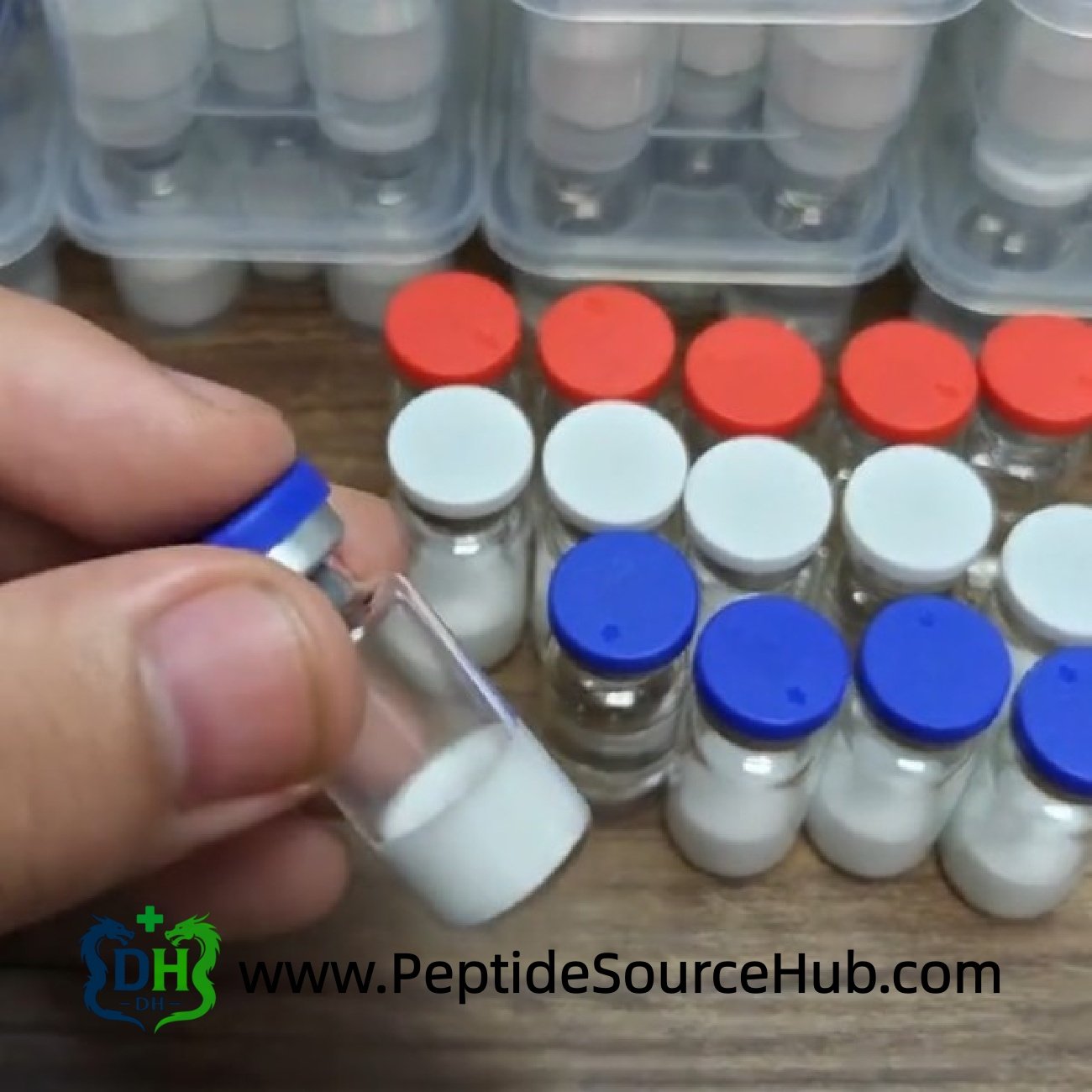 Hand holding blue cap Melatonin 10 mg vial