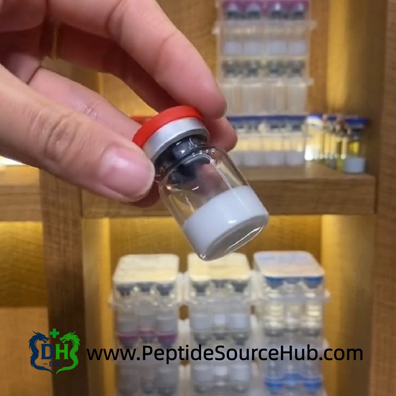 Single MOTS-C peptide vial with red cap held in front of shelves