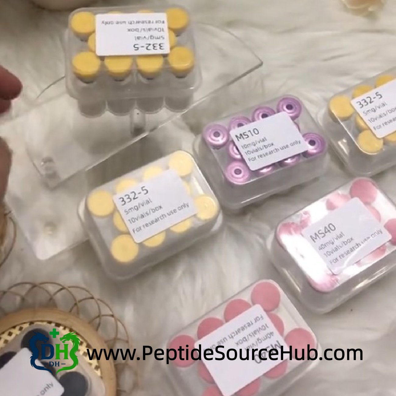 Color-coded MOTS-C peptide trays displayed on soft background