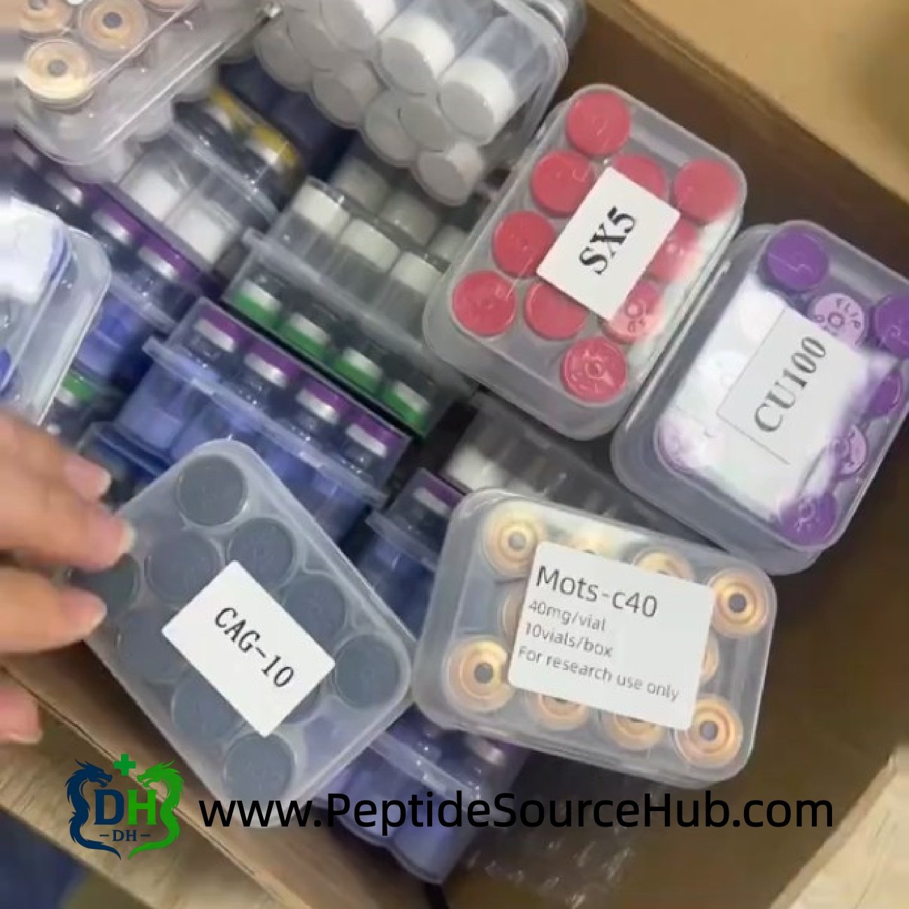 Box of MOTS-C40 and other peptide trays for research supply
