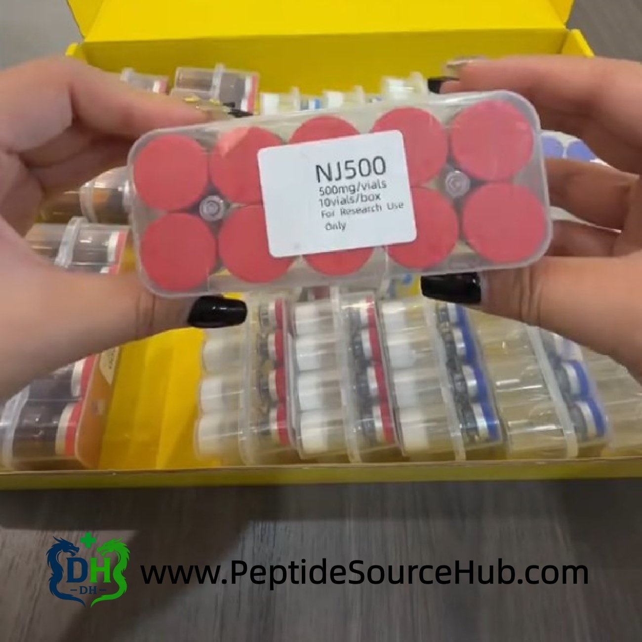 NJ500 NAD+ red-cap tray inside yellow gift-style box