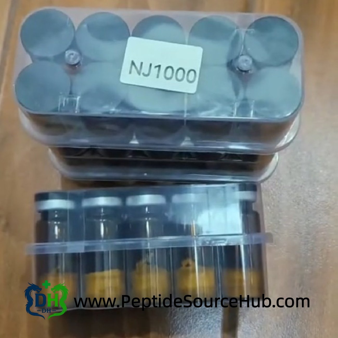 NJ1000 NAD+ amber vials with yellow powder on table