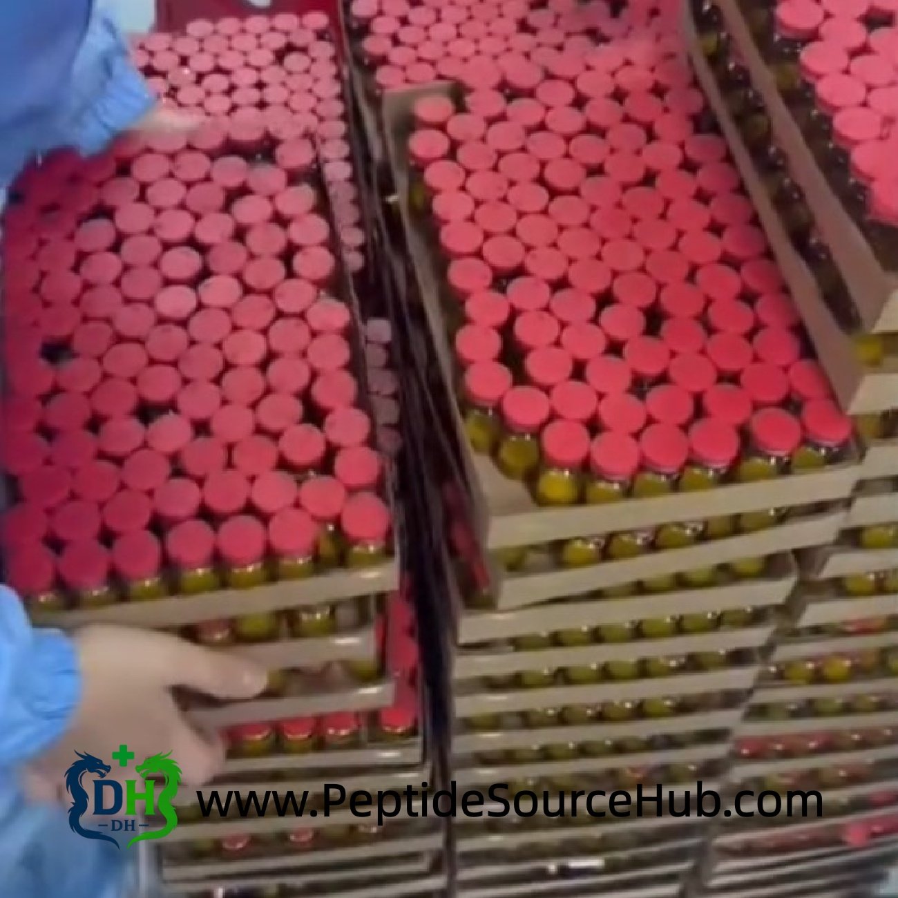 Bulk trays of NAD+ amber vials with red caps