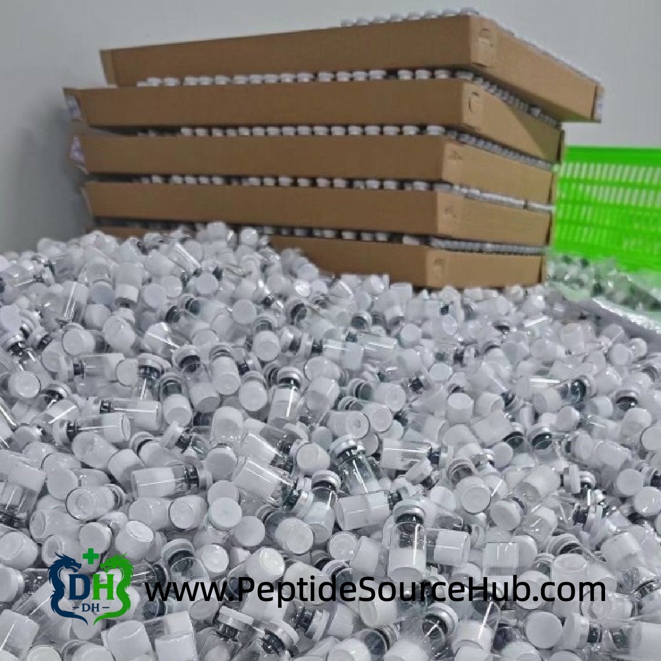 Bulk white-cap peptide vials piled for packaging