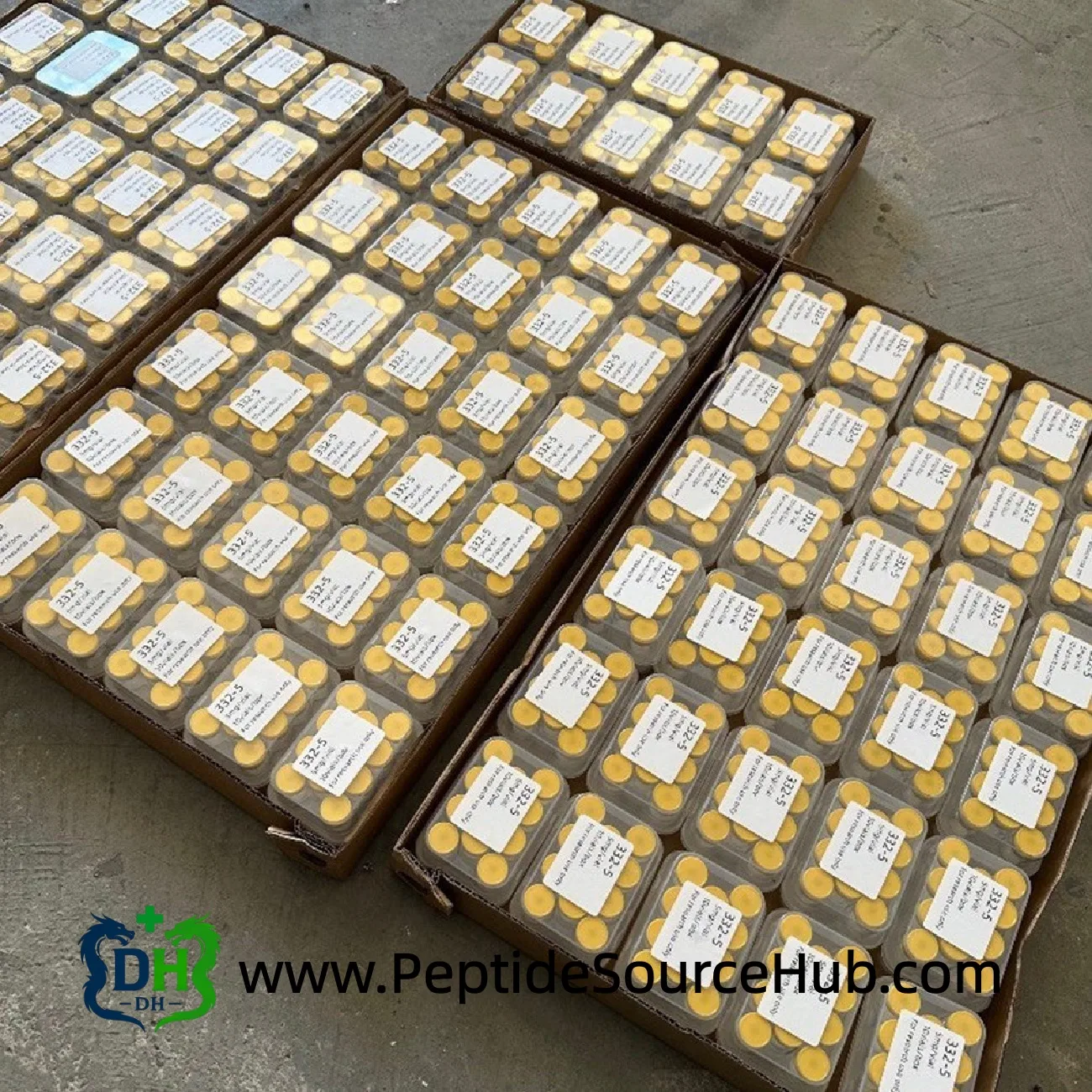 Large batch of SLU-PP-332 5mg peptide kits laid out for inspection
