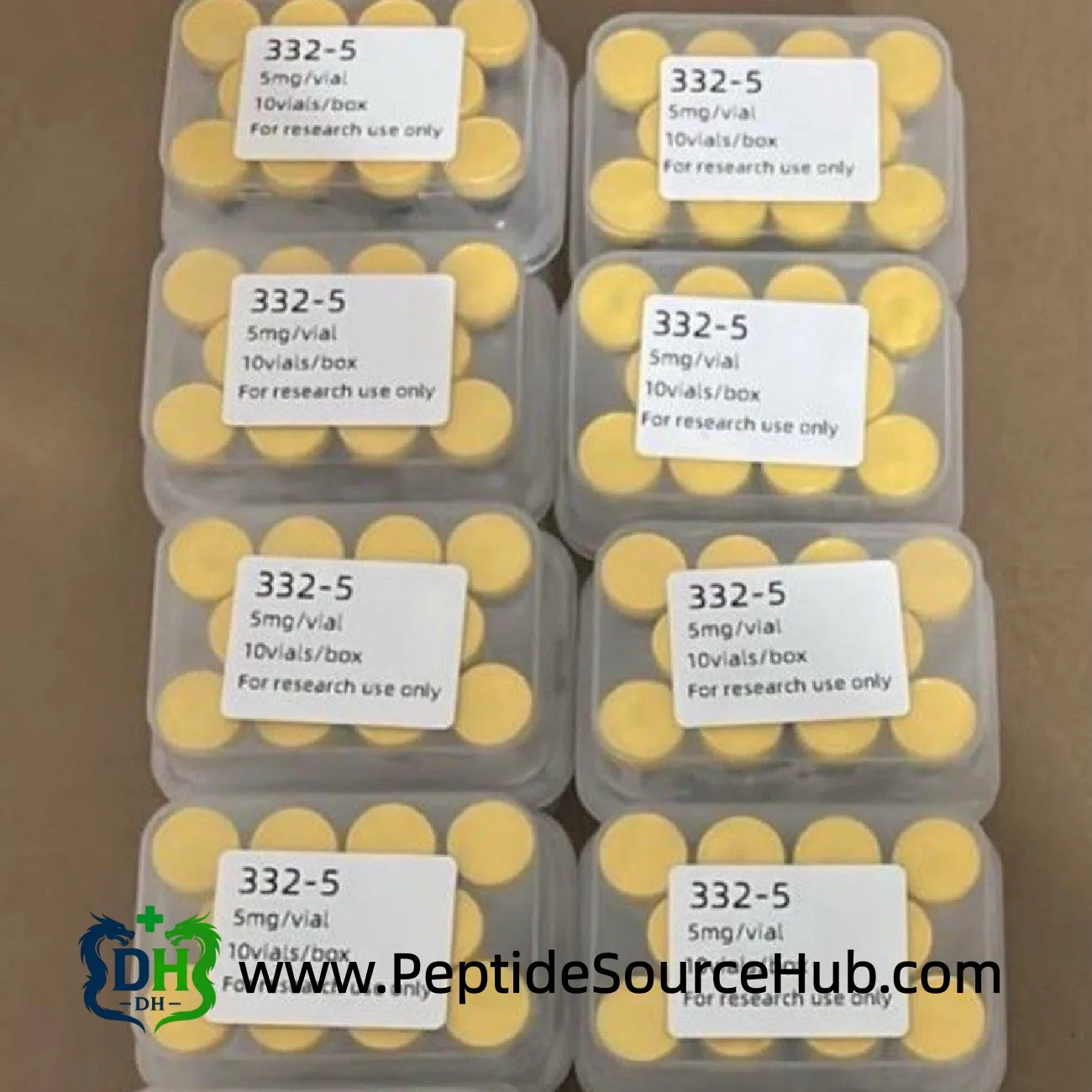 eight SLU-PP-332 5 mg kits lined up on brown surface