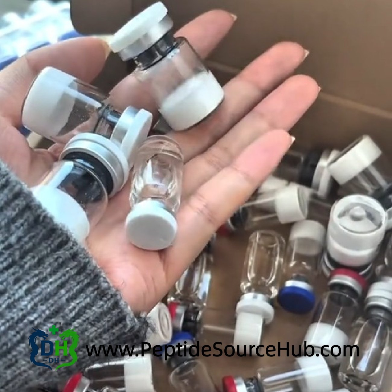 Handful of white-cap peptide vials used for SNAP-8 production