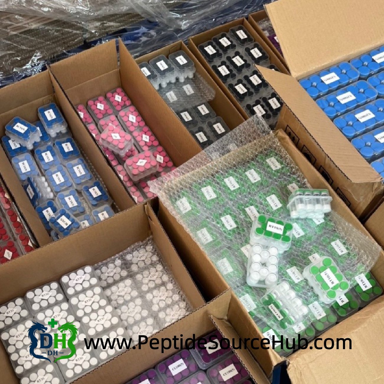 Bulk cartons of assorted peptide vials ready for export