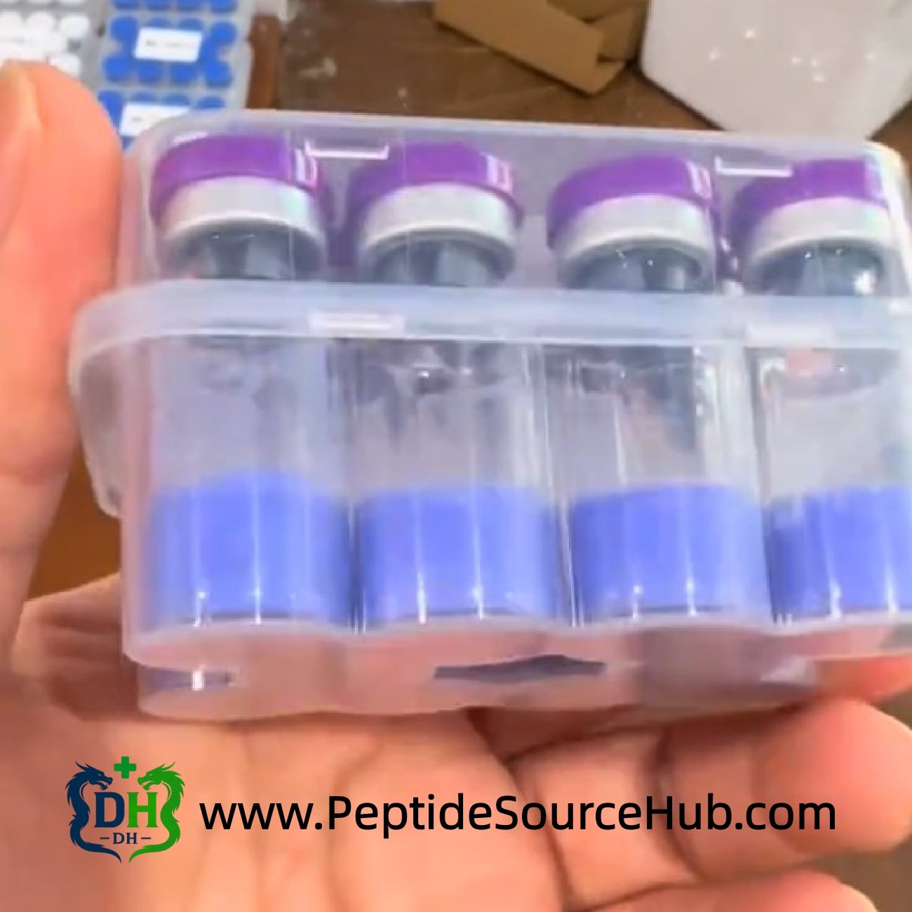 Close-up tray of purple-cap blue copper peptide blend vials