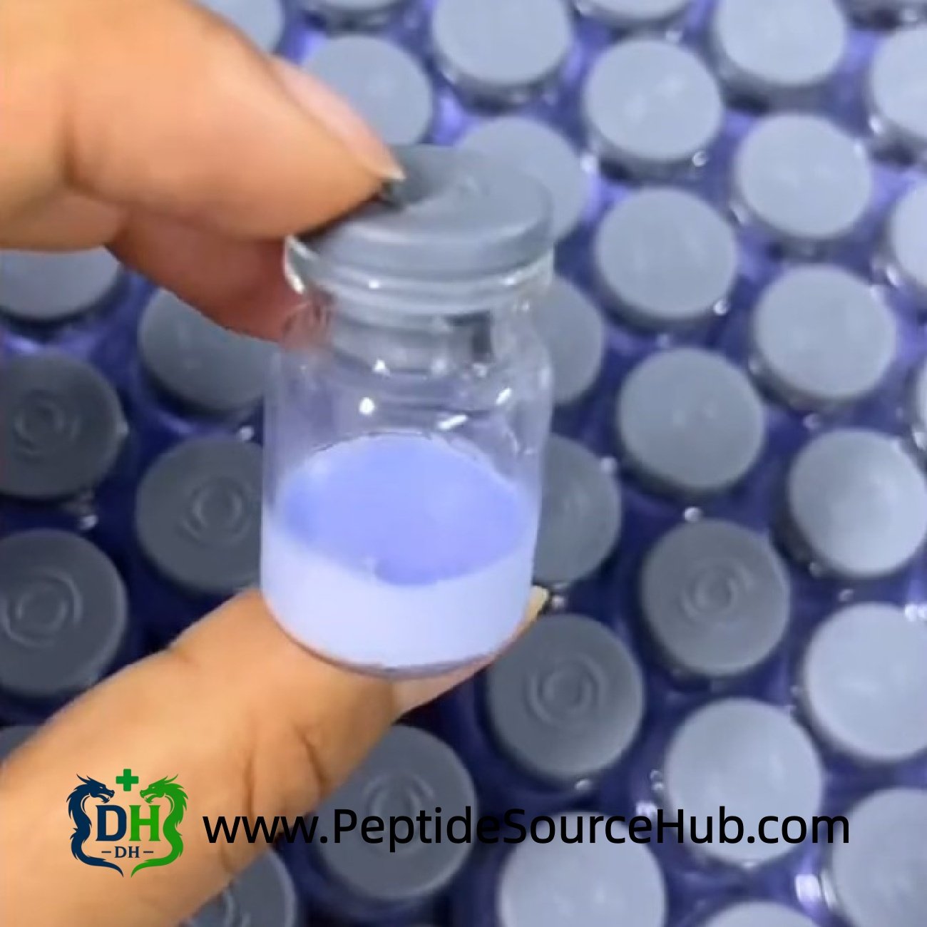 Close-up of grey-cap blue copper peptide vial