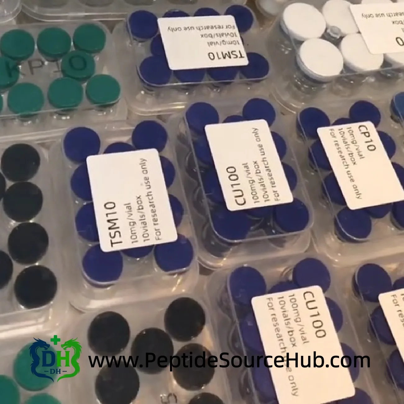 Tesamorelin TSM10 and CU100 peptide trays on bench