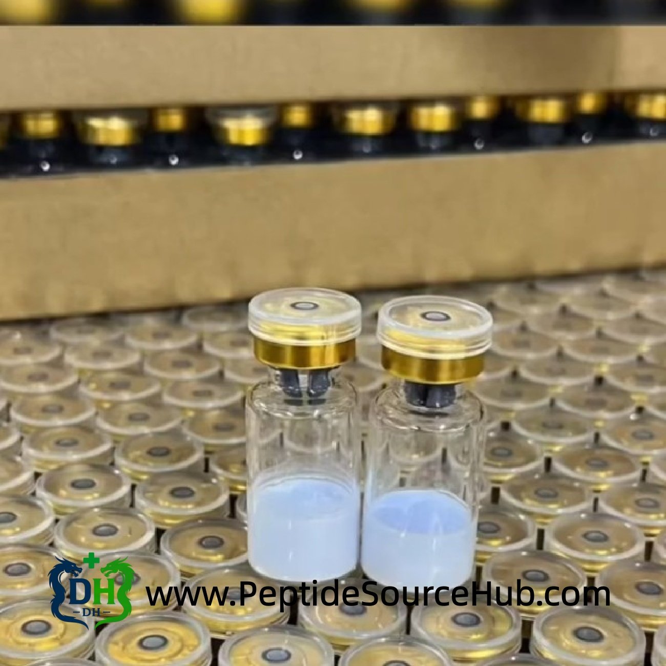 Two peptide vials with blue solution on production table