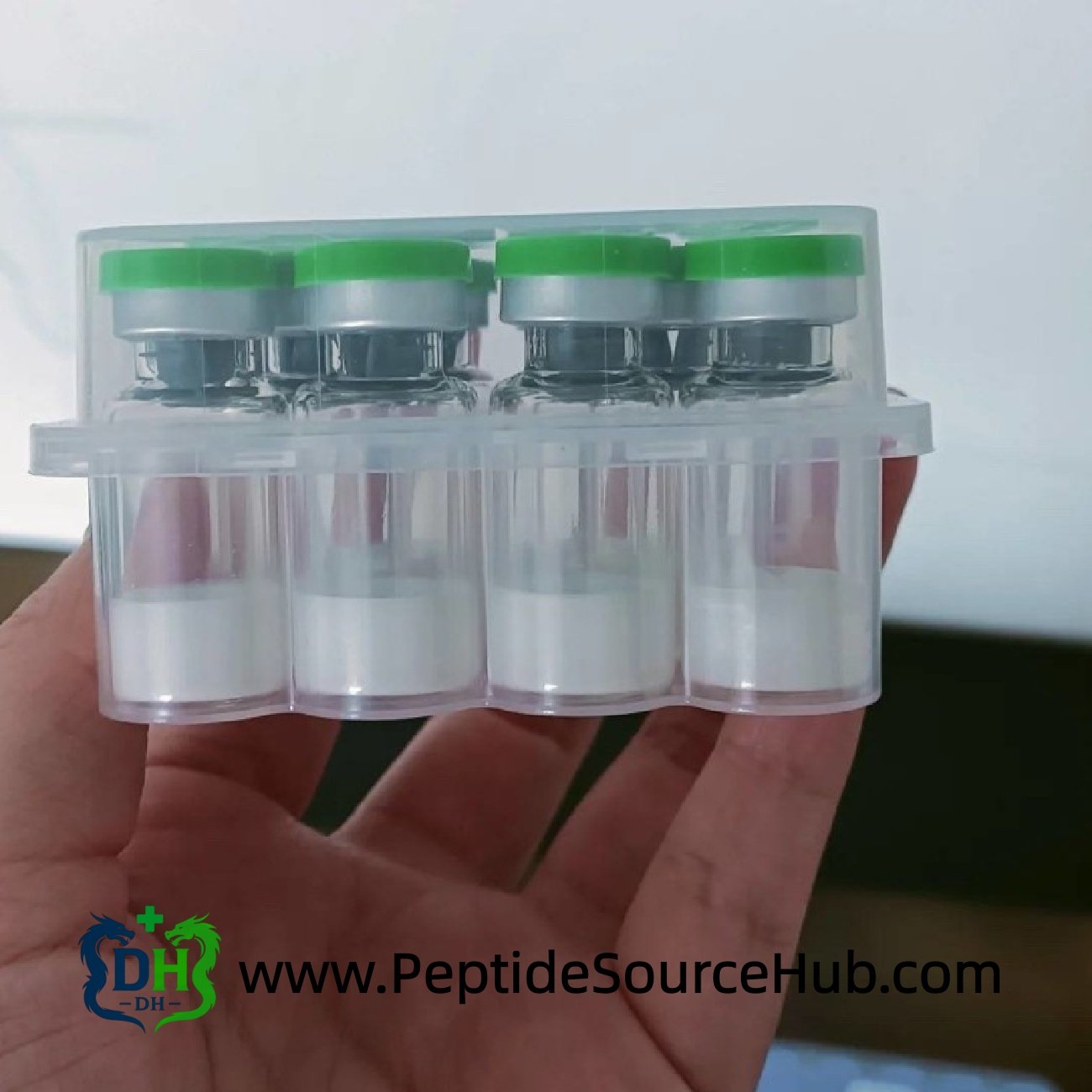 Side view of green cap Triptorelin vials in clear tray