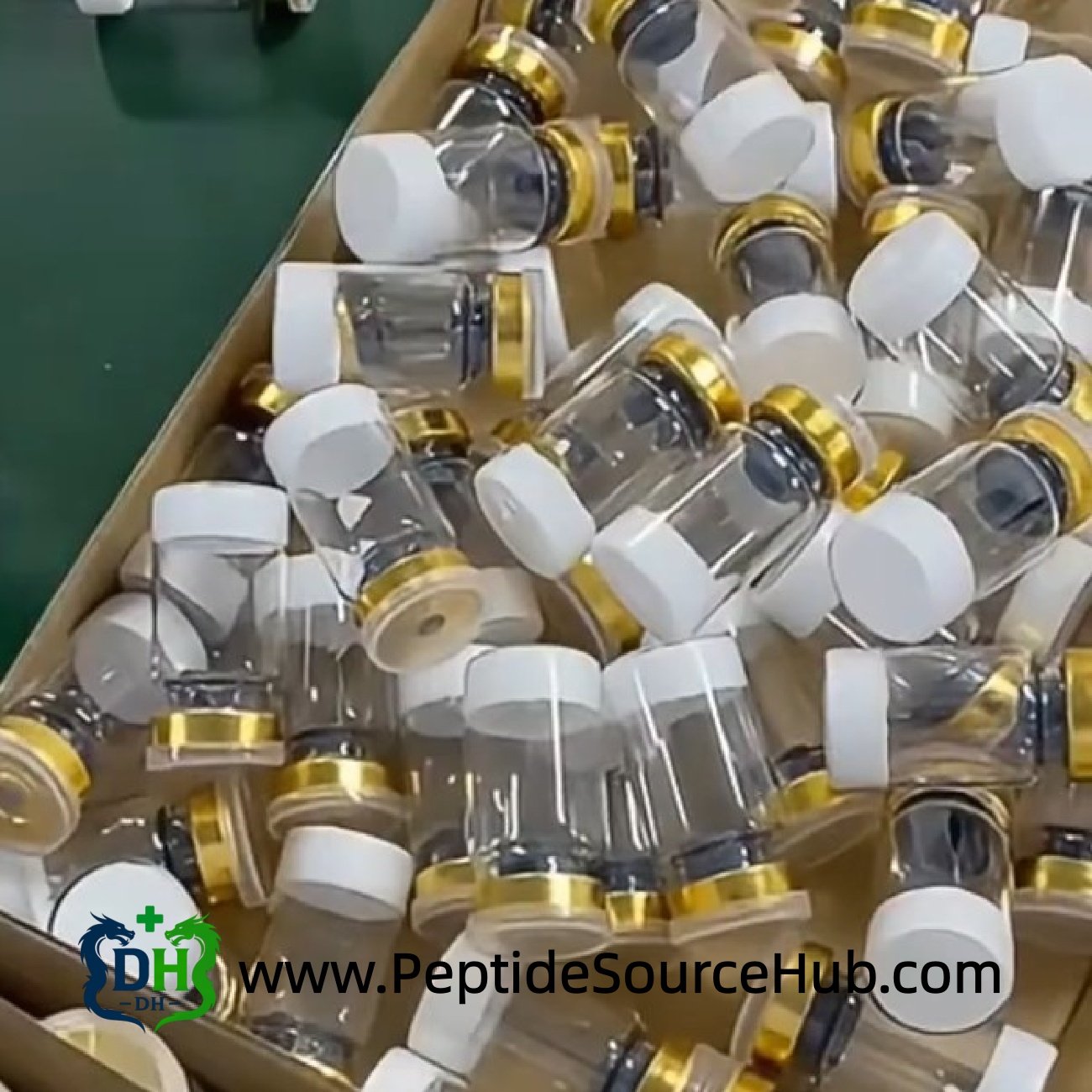 Close tray of gold cap vials in carton on production line