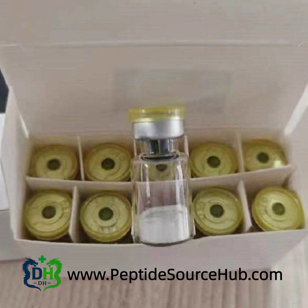 Triptorelin vial standing in open white box of gold caps