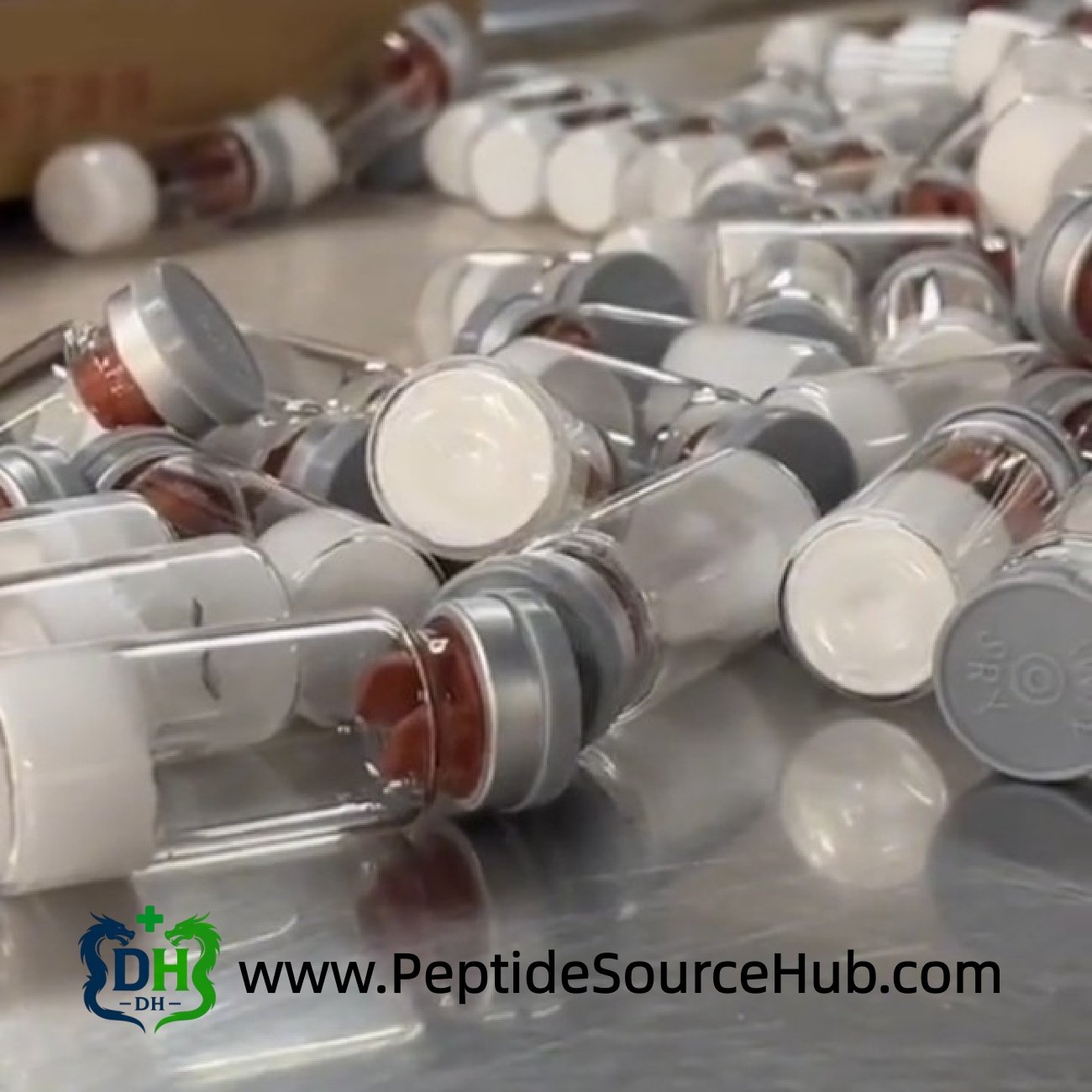 Sterile VIP-related peptide vials with grey caps on steel table