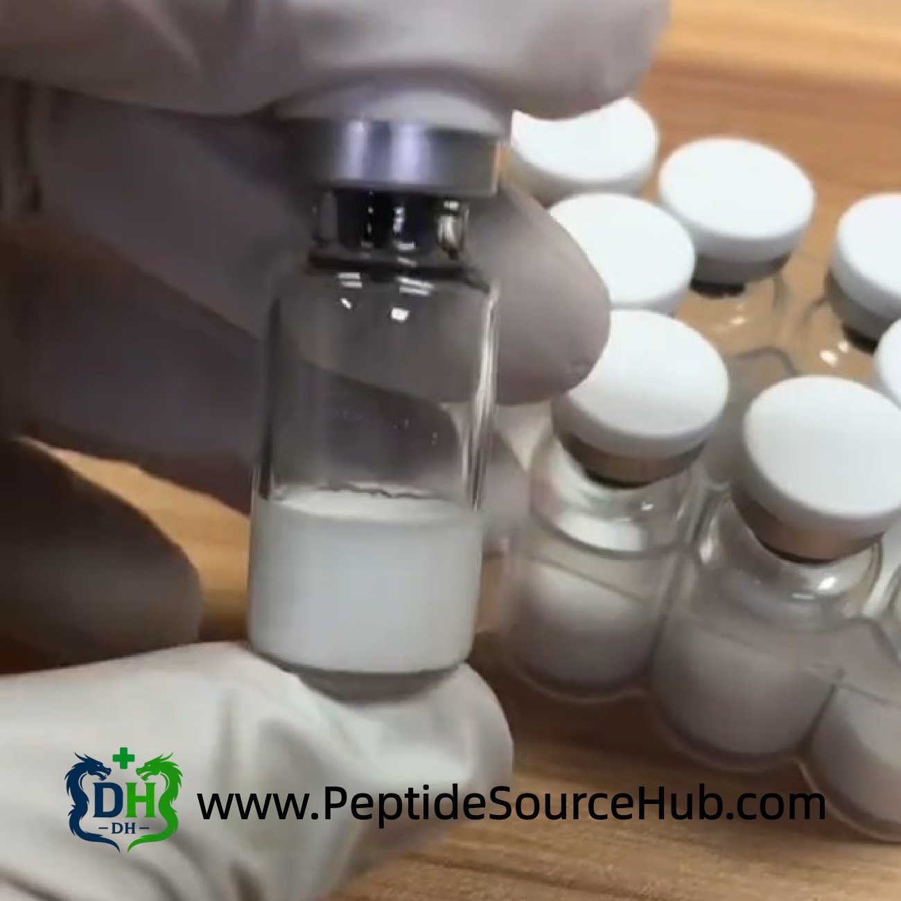 Gloved technician holding VIP peptide 10 mg vial